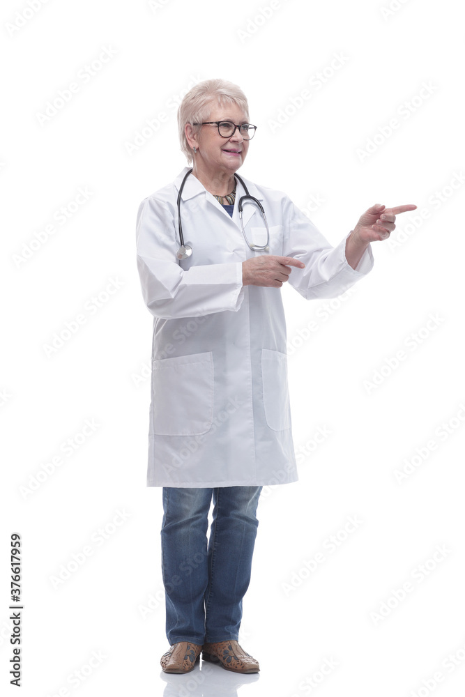 in full growth. smiling woman doctor pointing direction in full growth. smiling woman doctor pointing direction