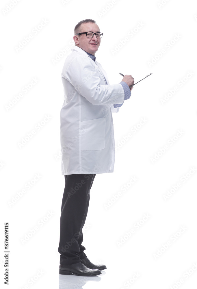 side view. a competent doctor prescribing a prescription for the patient. side view. a competent doctor prescribing a prescription for the patient.