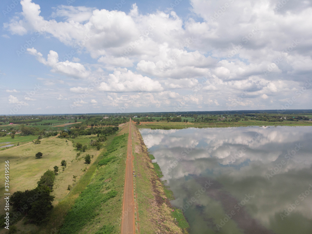 Naklejka premium Drone shot aerial view scenic landscape of river reservoir dam and the forest