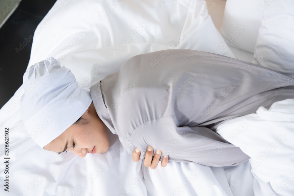 weak asian woman cancer patient wearing head scarf after suffering serious hair loss and pain due to chemotherapy weak asian woman cancer patient wearing head scarf after suffering serious hair loss and pain due to chemotherapy