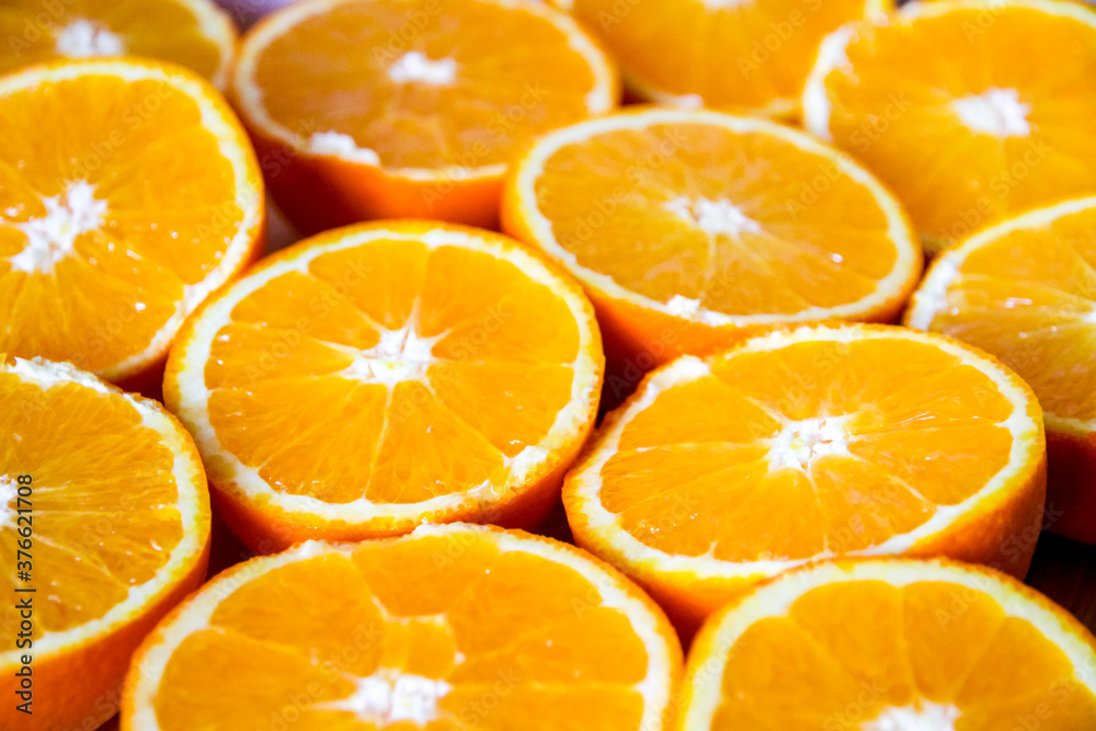 Bunch of fresh sliced oranges on a tray