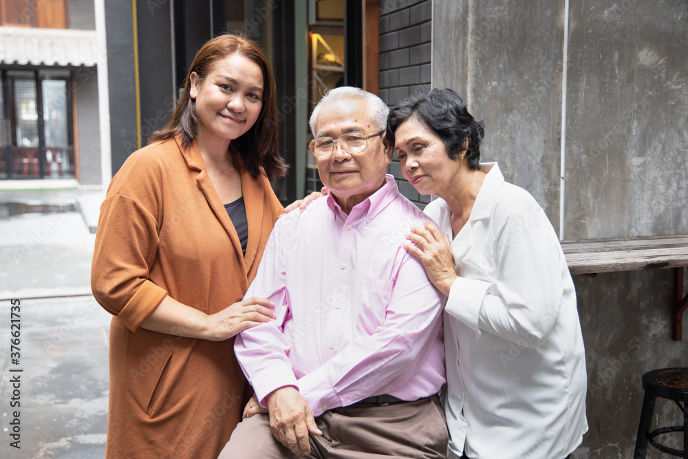 Fototapeta premium Asian family portrait of middle aged daughter with senior father and mother
