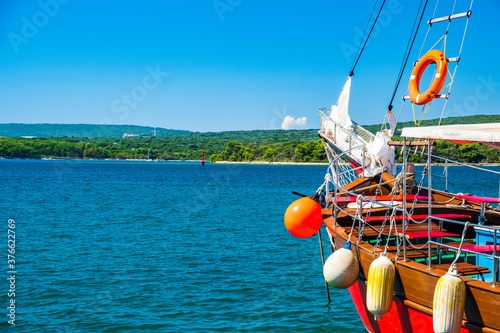 Waterfront and old ships in the harbor in town of Punat on the island of Krk, Adriatic coast, Croatia
 photo