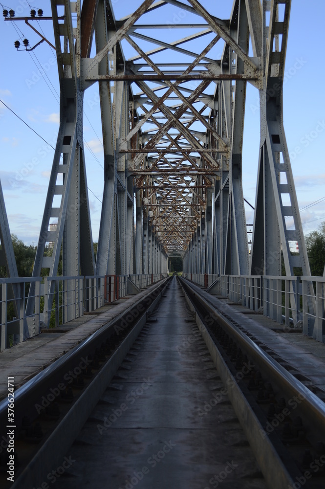 Railway bridge, railway tracks, metal structure.