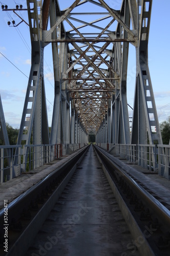 Railway bridge, railway tracks, metal structure.