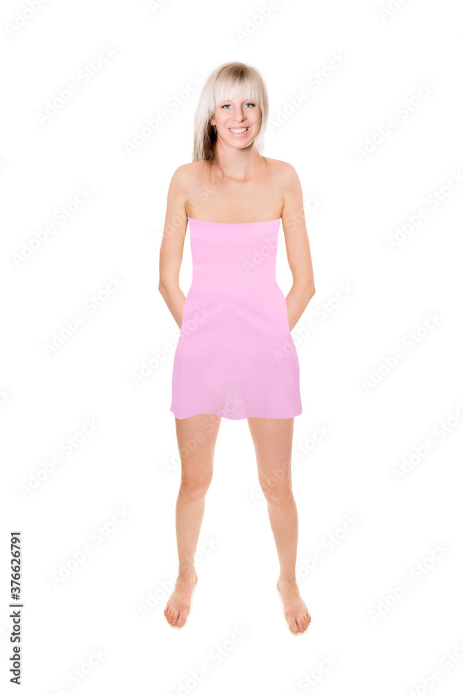 Full length portrait of a cheerful blonde woman wearing a short pink summer dress, isolated in front of white background Full length portrait of a cheerful blonde woman wearing a short pink summer dress, isolated in front of white background