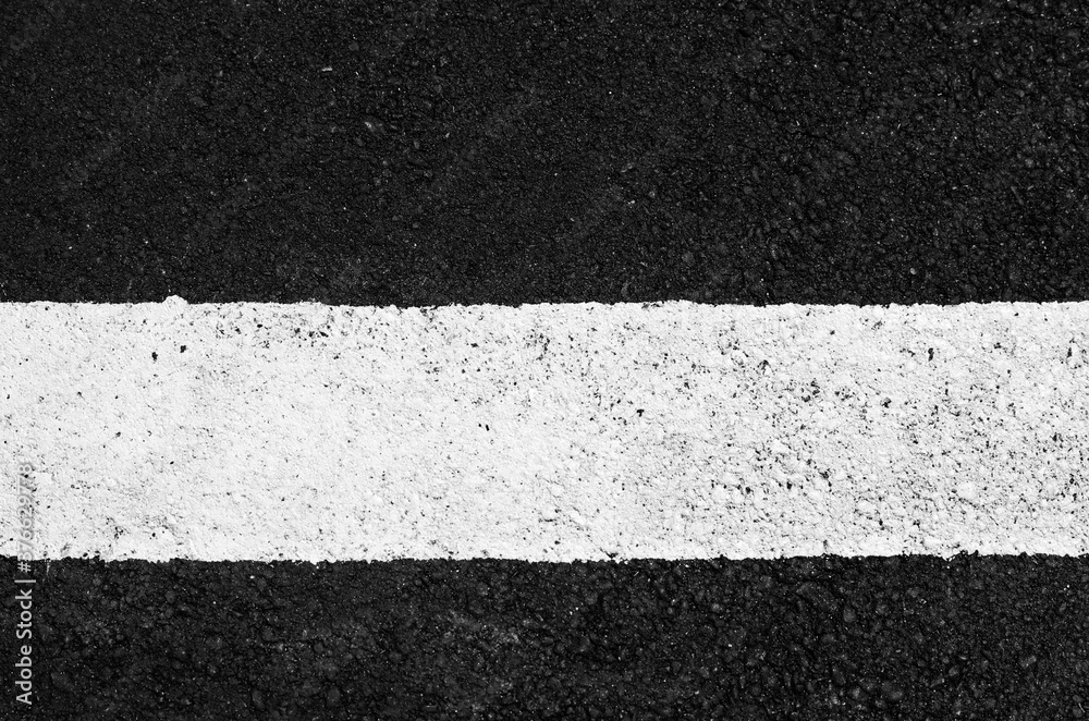 Fototapeta premium asphalt texture with a white line painted