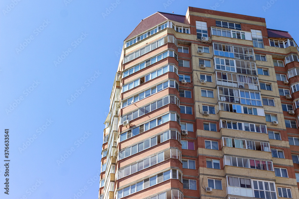 multi-storey building against the blue sky. suitable for advertising real estate, building construction. space for text.
