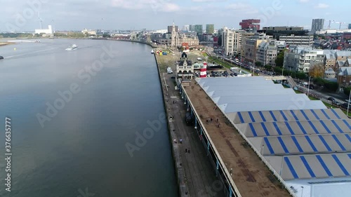 Aerial birds eye view of Antwerp city center flight alongside Scheldt River showing US Army Monument and the parking spaces below the boulevard nice summer day 4k high resolution quality footage photo