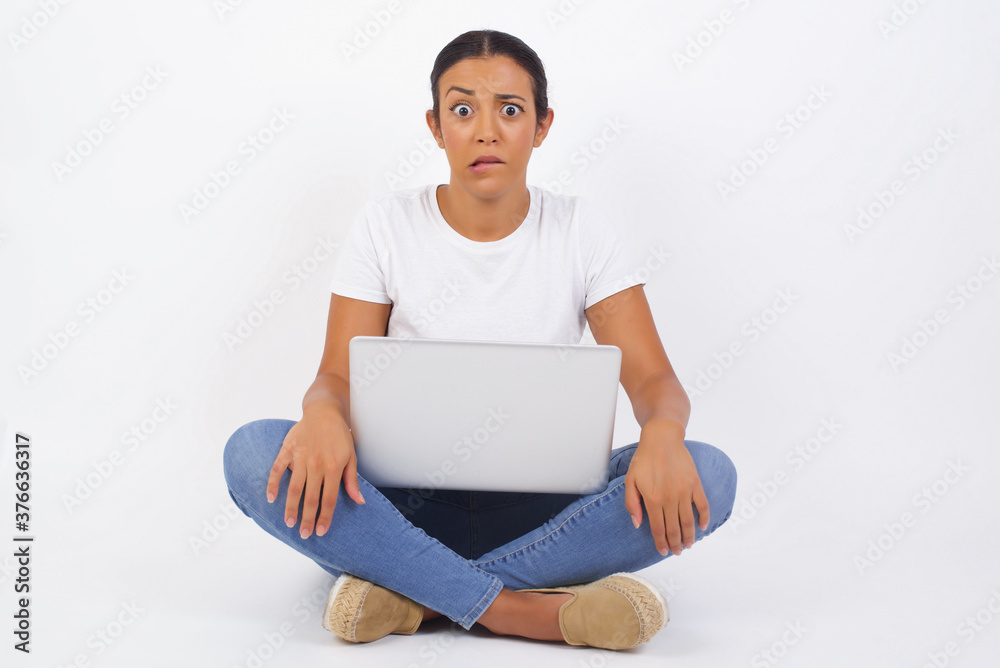 Beautiful young woman nervous and scared biting lips looking camera with impatient expression, pensive� Beautiful young woman nervous and scared biting lips looking camera with impatient expression, pensive�