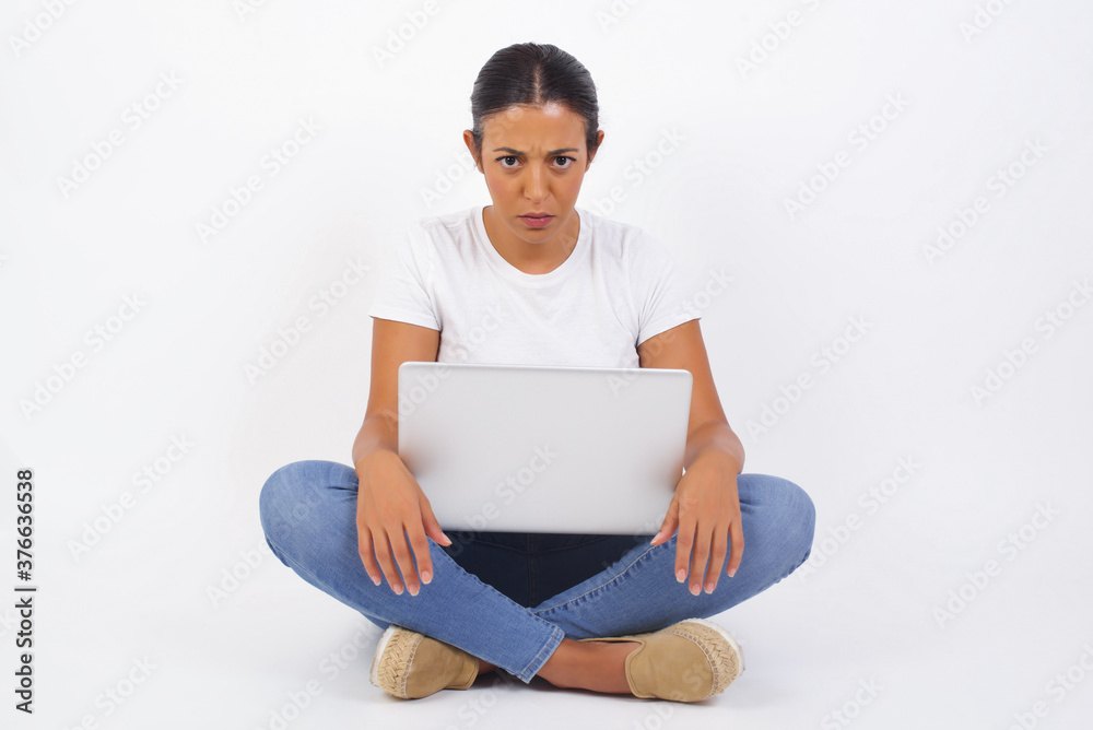Portrait of outraged young woman with oval face, frowning her eyebrows being displeased with something. Portrait of outraged young woman with oval face, frowning her eyebrows being displeased with something.