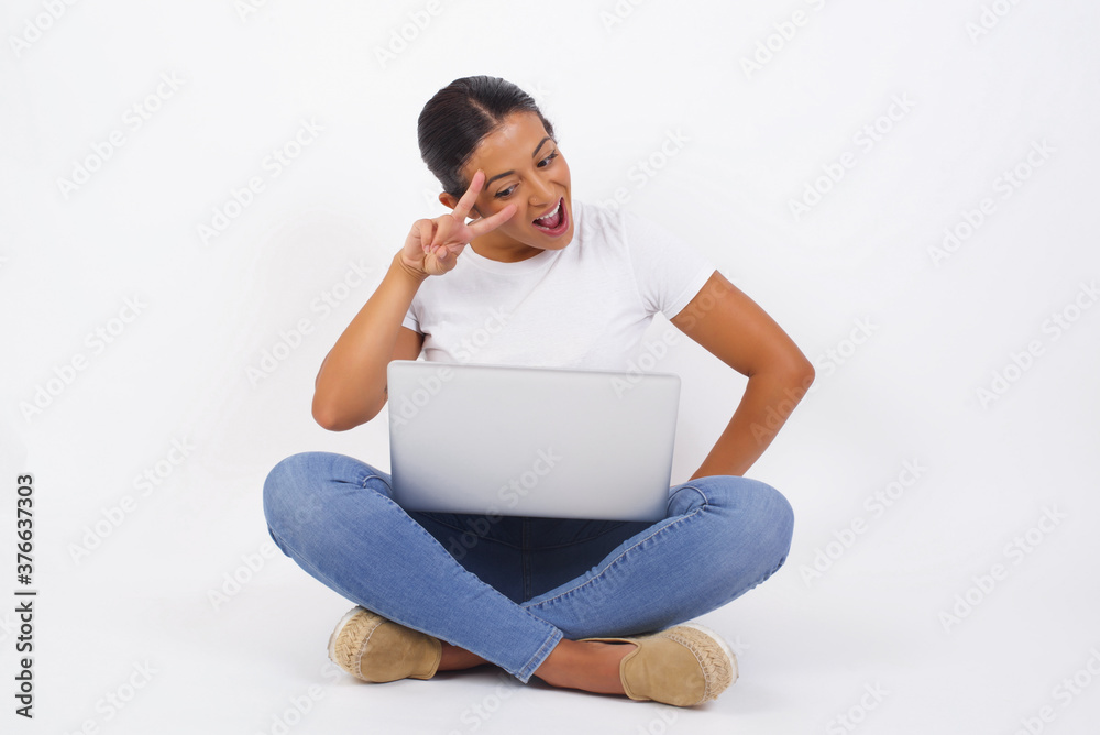 Leisure lifestyle people person celebrate flirt coquettish concept. Beautiful pretty lady v-sign near eyes wearing casual clothes standing indoors. Leisure lifestyle people person celebrate flirt coquettish concept. Beautiful pretty lady v-sign near eyes wearing casual clothes standing indoors.