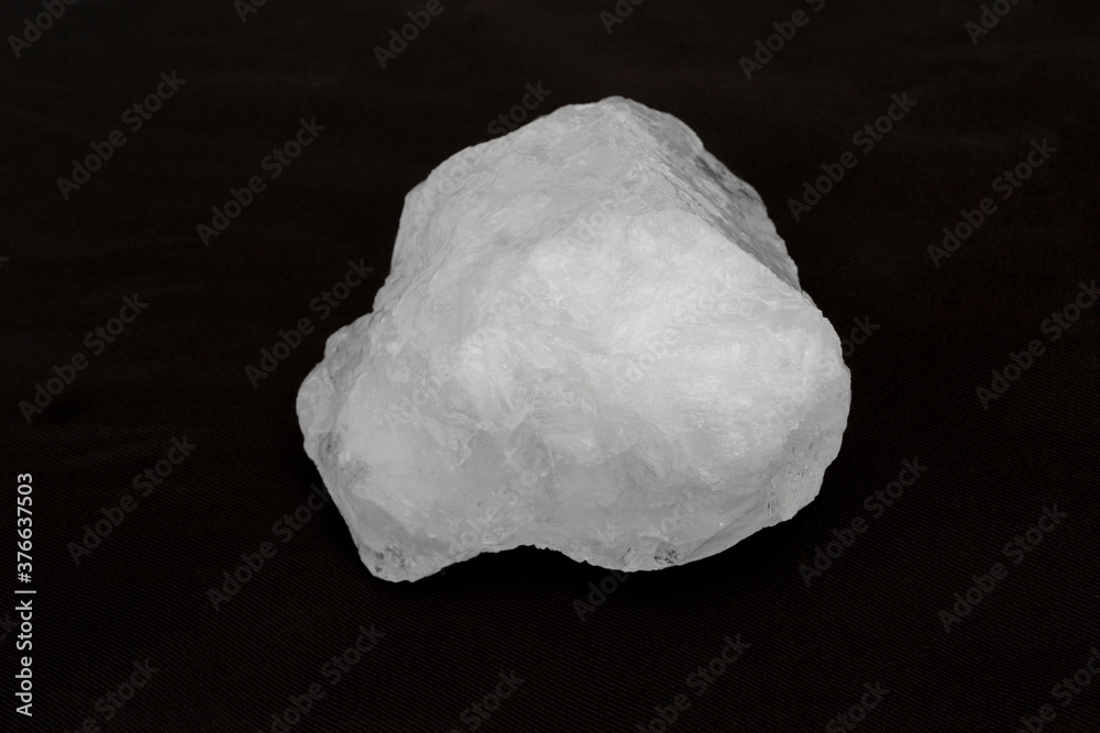 White crystal alum stone isolated on black background. White crystal alum stone isolated on black background.