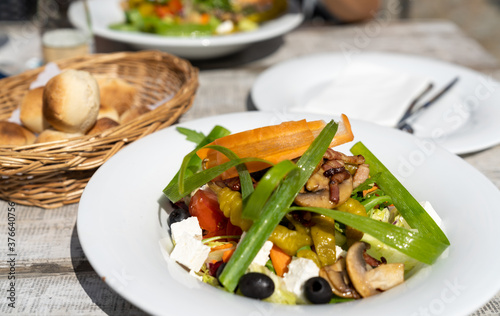 delicious Italian country salad with bacon and goat cheese and mushrooms
