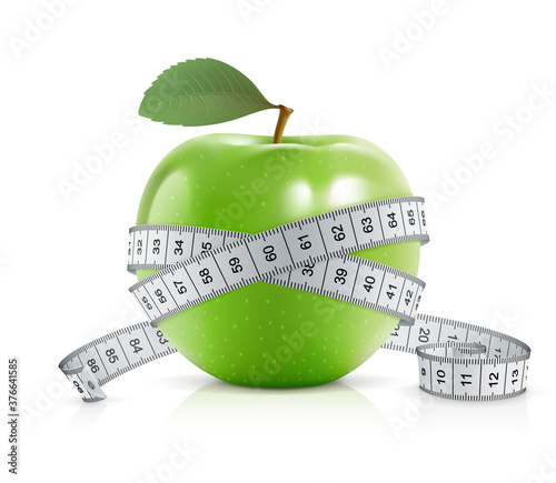 Green apple with measuring tape