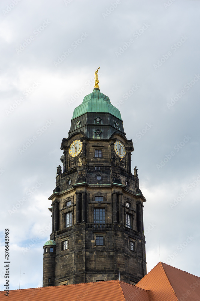the clock tower of the old historic city council in downtown Dresden