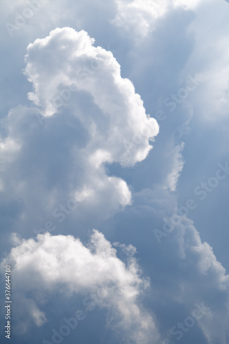 beautiful blue sky with clouds, nature background, film grain noise effect
