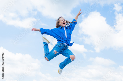 kid jump outdoor. kid fashion and beauty. sense of freedom. portrait of energetic child girl. concept of future. happy childhood. cheerful teen girl jumping high. Hip hop girl