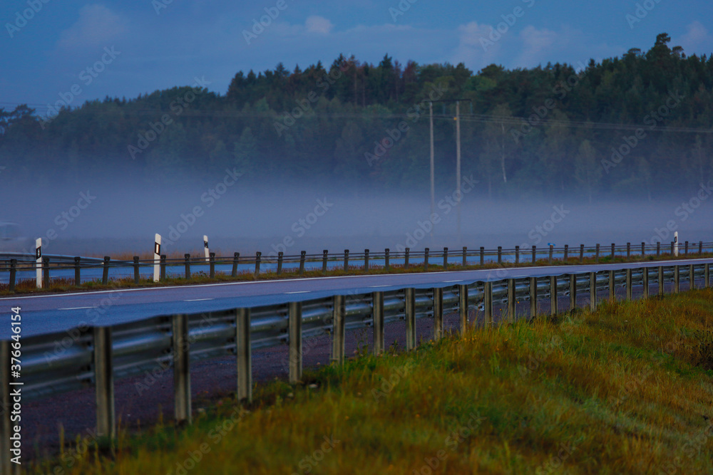 Naklejka premium Oxelosund, Sweden A highway at dawn and traffic