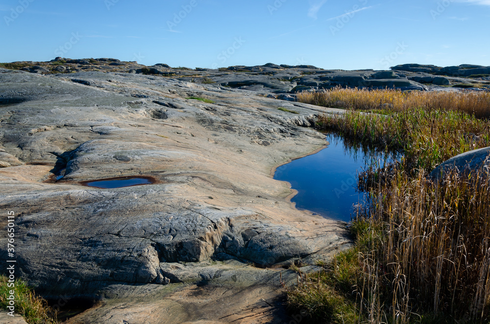 Blue sky, sea, nice cliffs. View of the archipelago in northern Gothenburg. A nice summer day in Sweden. Place for text, copy space. Blue sky, sea, nice cliffs. View of the archipelago in northern Gothenburg. A nice summer day in Sweden. Place for text, copy space.