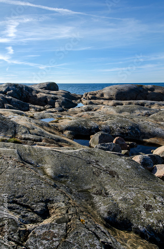 Blue sky, sea, nice cliffs. View of the archipelago in northern Gothenburg. A nice summer day in Sweden. Place for text, copy space.