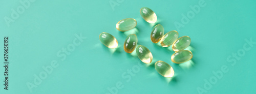 Fish oil capsules on a blue background. Omega-3