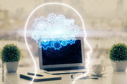 Double exposure of desktop with computer and brain drawing hologram. Artificial intelligence concept.