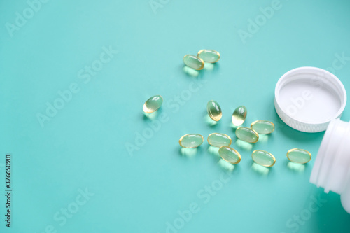 Fish oil capsules on a blue background. Omega-3
