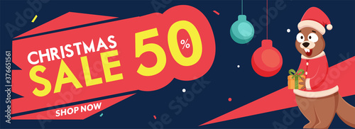 Christmas Sale Header or Banner Design with 50% Discount Offer, Hanging Baubles and Cartoon Squirrel Holding Gift Box on Blue Background.