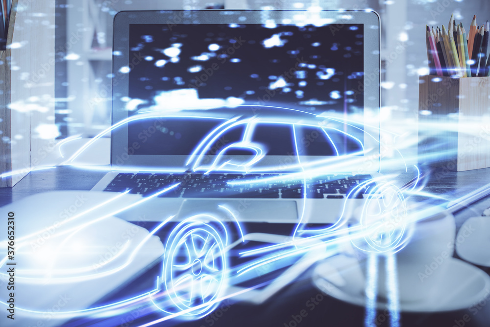 Desktop computer background in office with automobile hologram drawing. Multi exposure. Tech concept. Desktop computer background in office with automobile hologram drawing. Multi exposure. Tech concept.