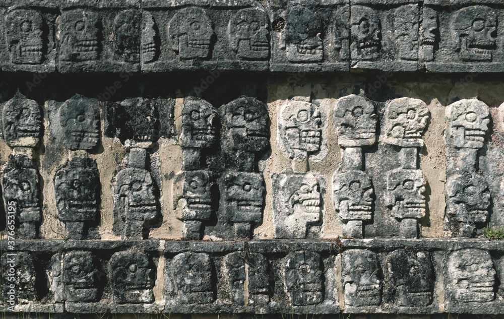 Detail of carved skulls in a Mayan temple in Chichen Itza, Yucatan, Mexico