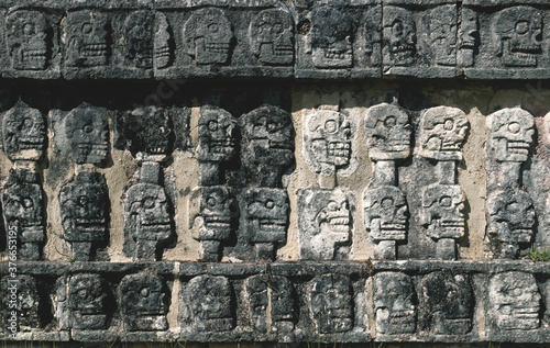 Detail of carved skulls in a Mayan temple in Chichen Itza, Yucatan, Mexico photo
