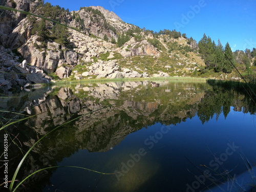 reflection of the mountains in a lake in Benasque
