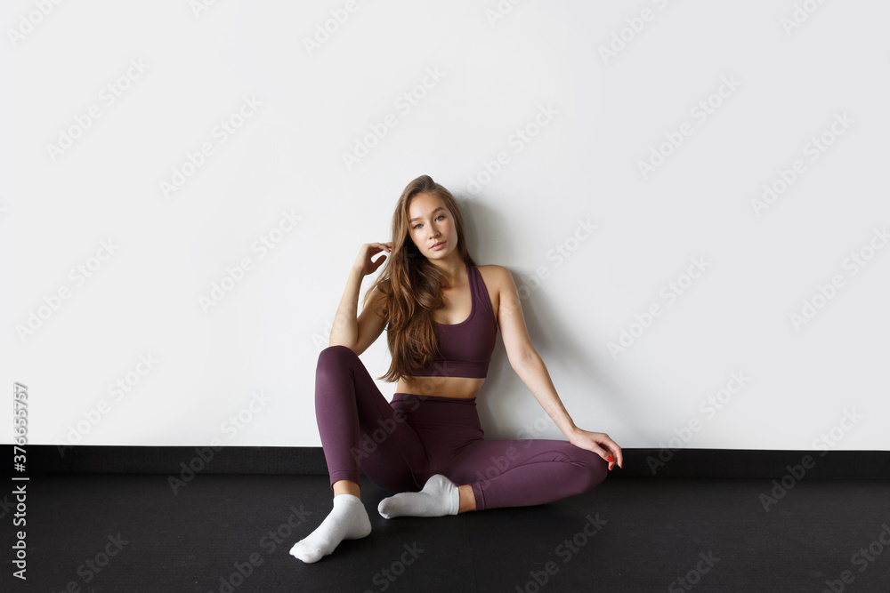 Portrait of a healthy young woman on a white background. Healthy lifestyle, motivation and a beautiful figure. Portrait of a healthy young woman on a white background. Healthy lifestyle, motivation and a beautiful figure.