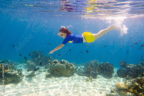 Child snorkeling. Kids underwater. Beach and sea.