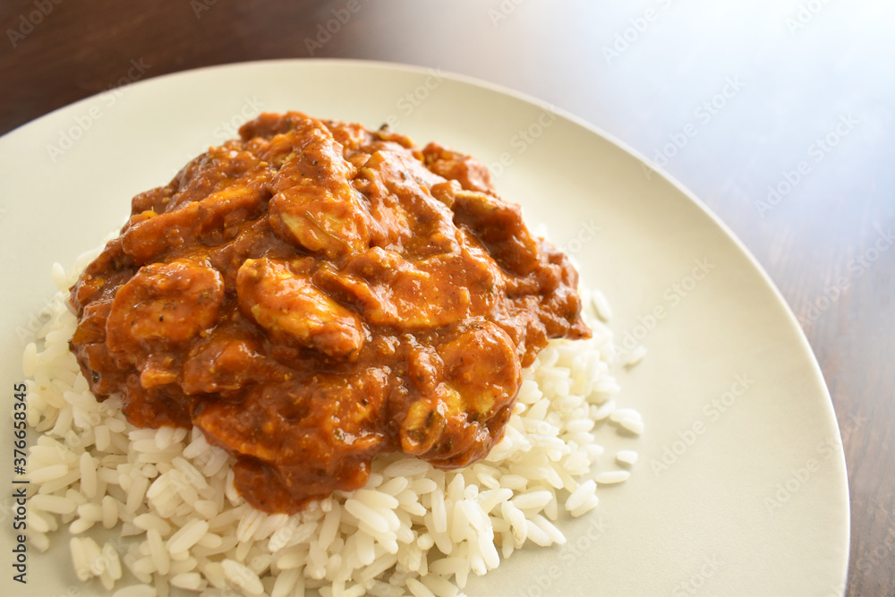Chicken Tikka Masala with rice. Copy space is on the right side. Chicken Tikka Masala with rice. Copy space is on the right side.