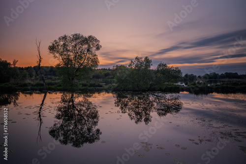 Long exposure fantastic sunset view on Bartatov Bartativ  Morozy village region Lviv. Lake and forest. Lviv district  Ukraine. May 2020