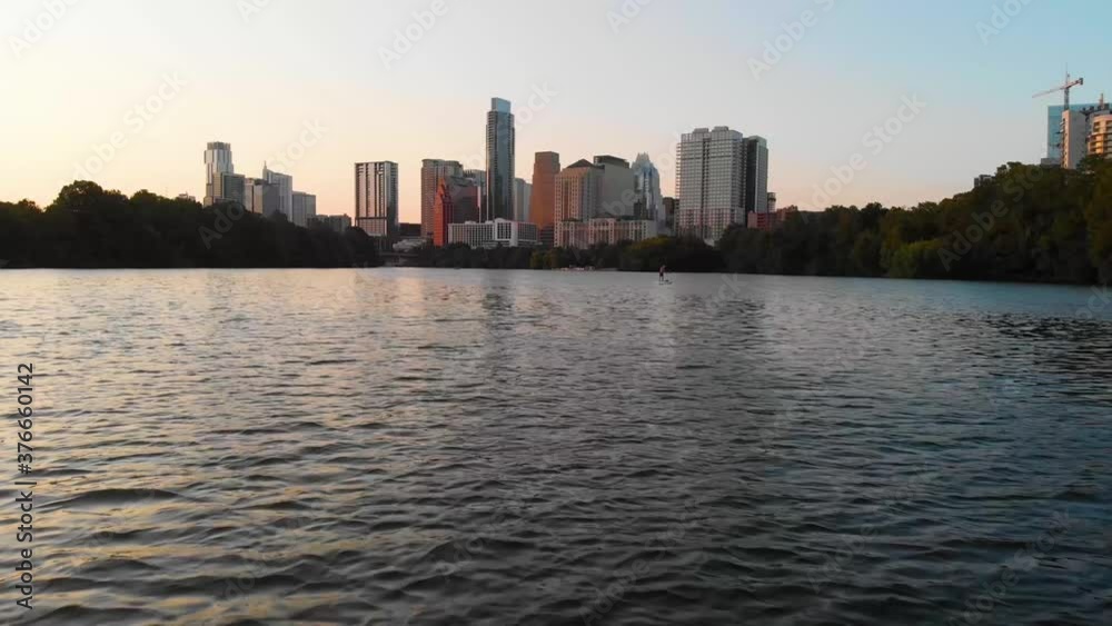 Low drone shot passing a circle boat and approaching the downtown Skyline. Shot in August 2020 Low drone shot passing a circle boat and approaching the downtown Skyline. Shot in August 2020