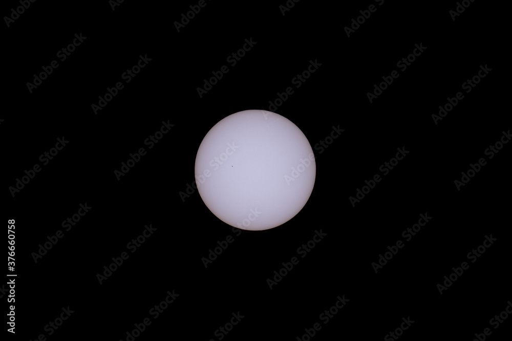 Huge sun with sunspot over black background Huge sun with sunspot over black background