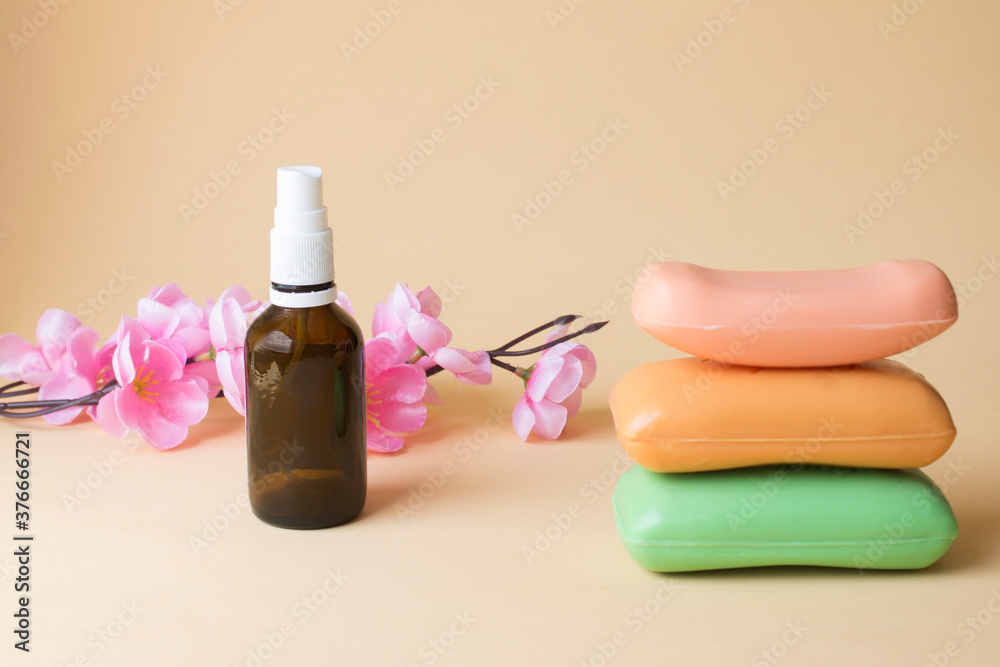 Stack of soap with pink flower and floral spray Stack of soap with pink flower and floral spray