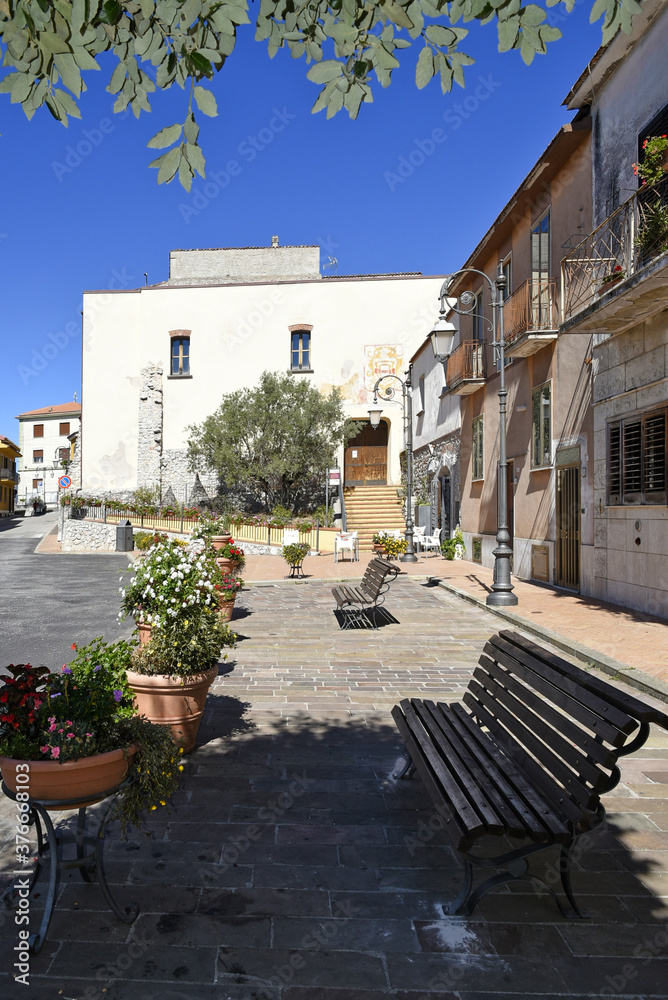 Fototapeta premium A small road crosses the old buildings of Grumento Nova, a rural village in the Basilicata region, Italy.