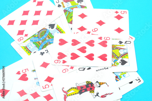 Scattered playing cards on a blue background