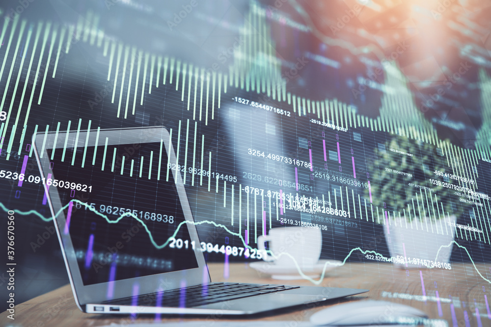 Forex market graph hologram and personal computer on background. Multi exposure. Concept of investment. Forex market graph hologram and personal computer on background. Multi exposure. Concept of investment.