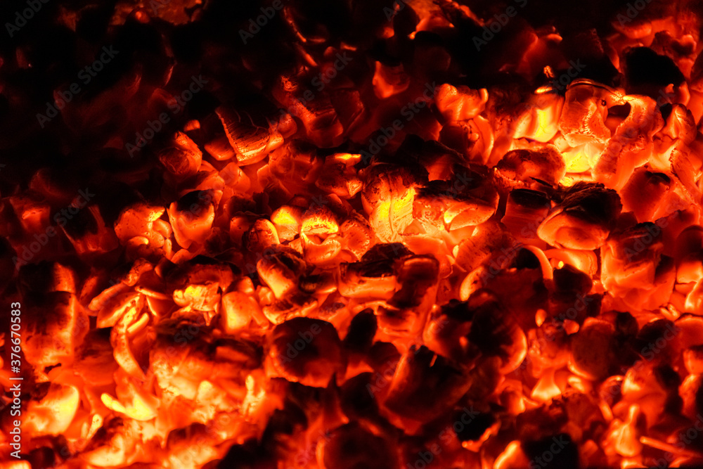 Hot and burning coals in a brazier at night. Hot and burning coals in a brazier at night.