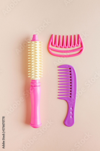 Set of children s toys hair dryer  combs. Concept of toys for girls  hair salon  children s beauty salon.