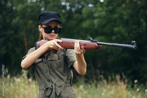 Woman weapons Sunglasses weapon hunting lifestyle green trees 