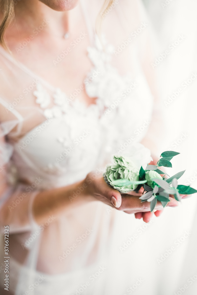 Bride holding beautiful bouquet with flowers