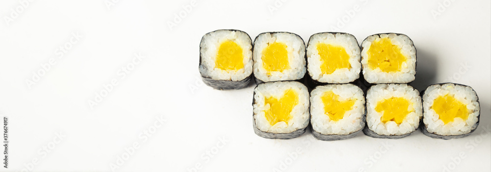 Sushi roll with takuan on a white plate, classic Japanese sushi. Traditional Japanese food with maki. Delicious pieces of sushi. For the restaurant menu. copyspace Sushi roll with takuan on a white plate, classic Japanese sushi. Traditional Japanese food with maki. Delicious pieces of sushi. For the restaurant menu. copyspace