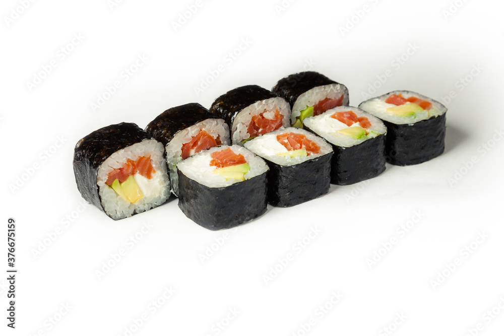 Sushi roll with smoked salmon and avocado on a white plate, classic Japanese sushi. Traditional Japanese food with maki. Delicious pieces of sushi. For the restaurant menu. copyspace Sushi roll with smoked salmon and avocado on a white plate, classic Japanese sushi. Traditional Japanese food with maki. Delicious pieces of sushi. For the restaurant menu. copyspace