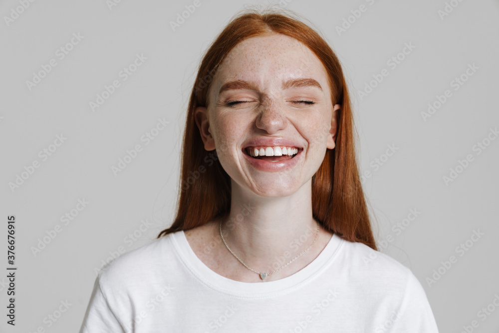 Image of happy ginger caucasian girl laughing at camera Image of happy ginger caucasian girl laughing at camera